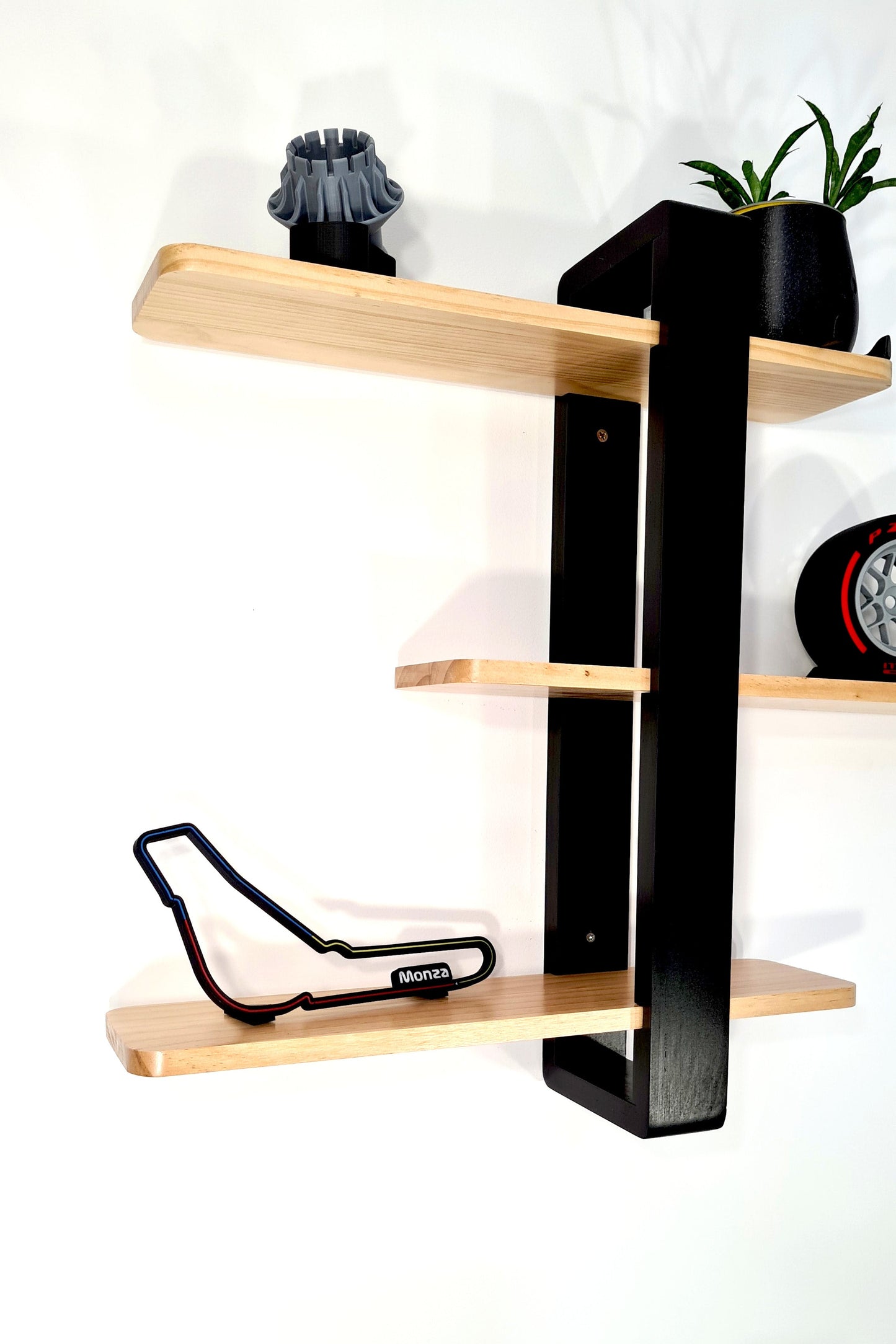 Black 3D printed Monza Formula 1 circuit, Pirelli tire, and turbo fan models for F1 fan decor.
