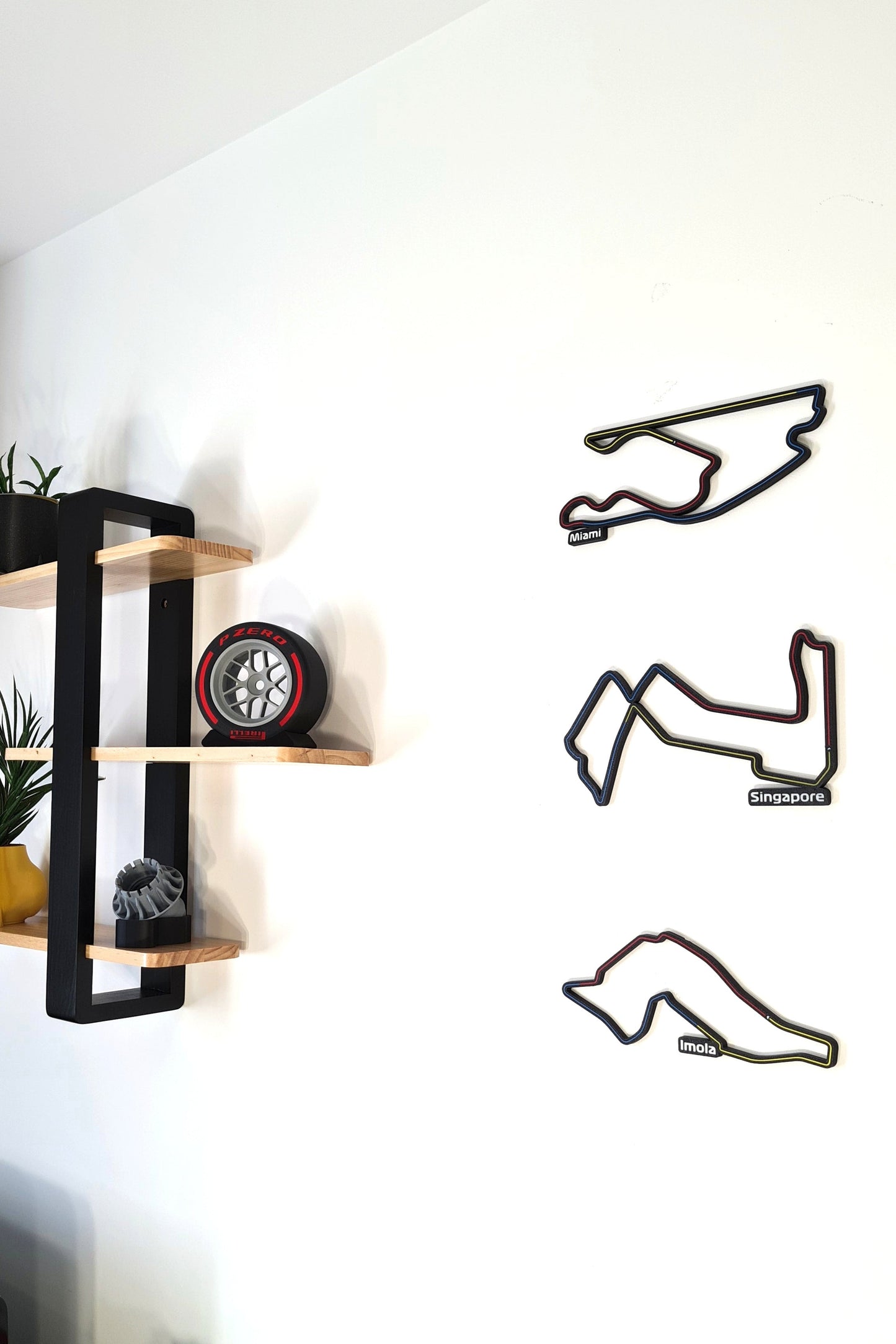 F1 3D track wall art (Miami, Singapore, Imola circuits) and Pirelli tire replica, perfect motorsport fan gift.
