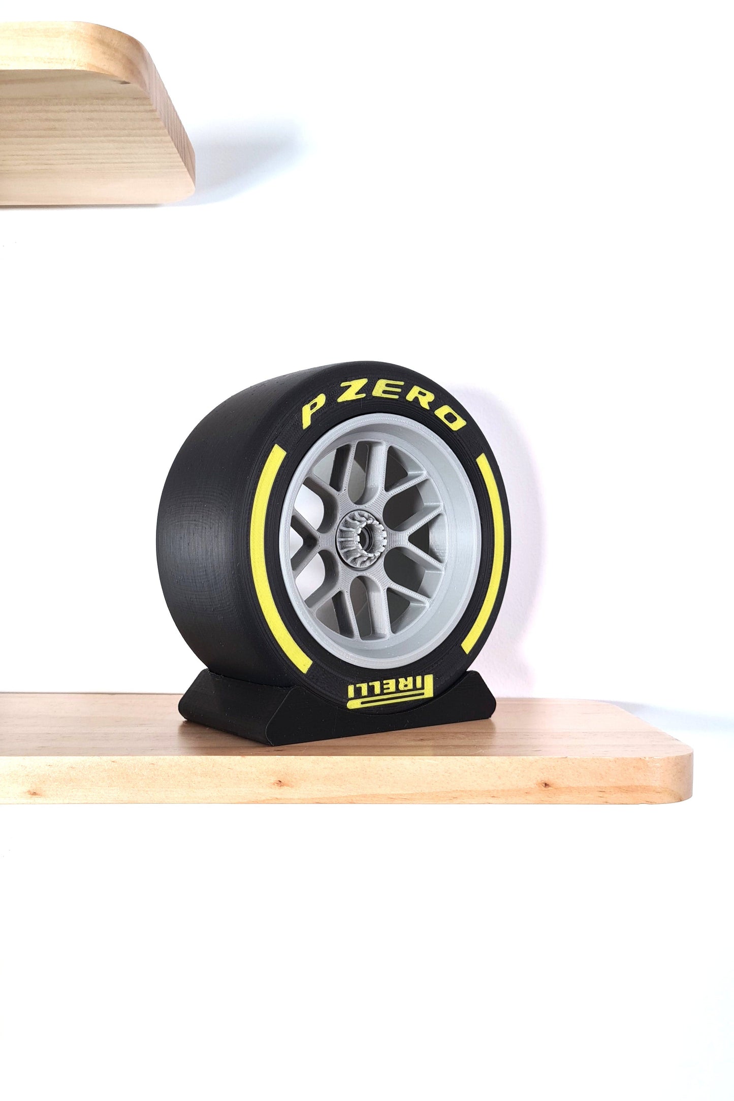 Pirelli P Zero yellow F1 soft tire wheel replica display model for motorsport fans.