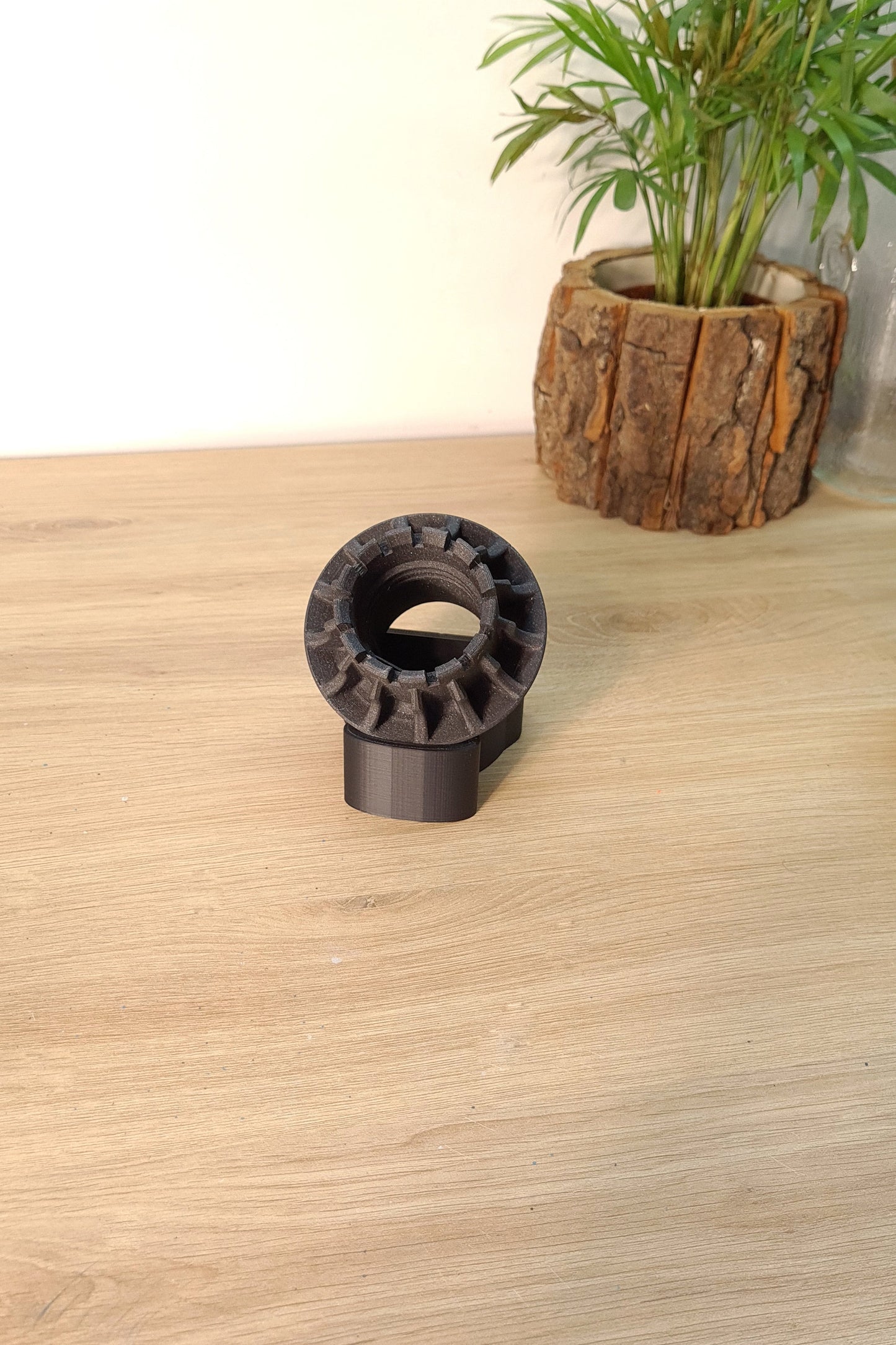 Dark grey 3D printed Formula 1 wheel nut replica display model, ideal F1 fan gift.