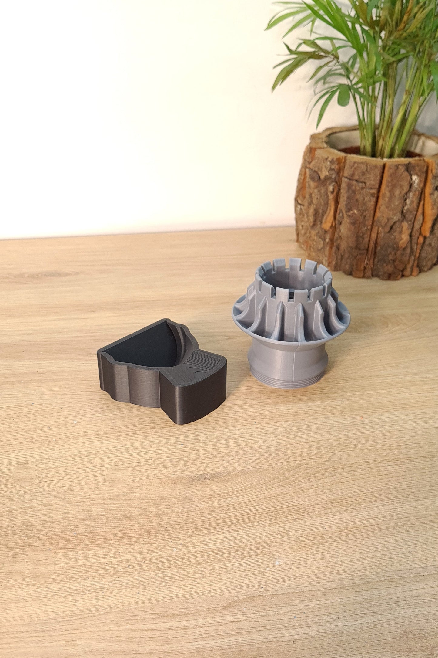 Grey 3D printed F1 wheel hub replica and black display stand, ideal F1 fan gift.