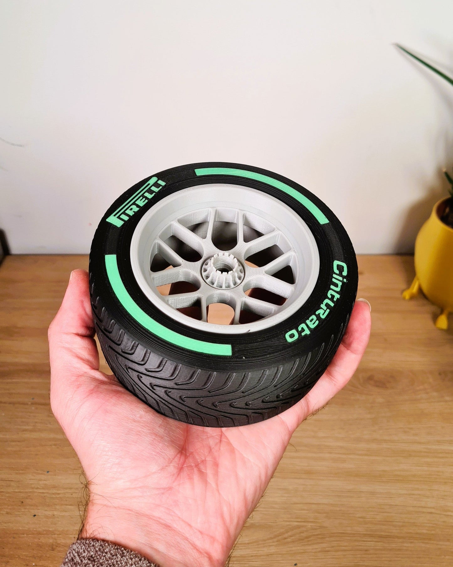 Pirelli F1 green wet tire replica model, ideal Formula 1 motorsport fan gift or desk decor.