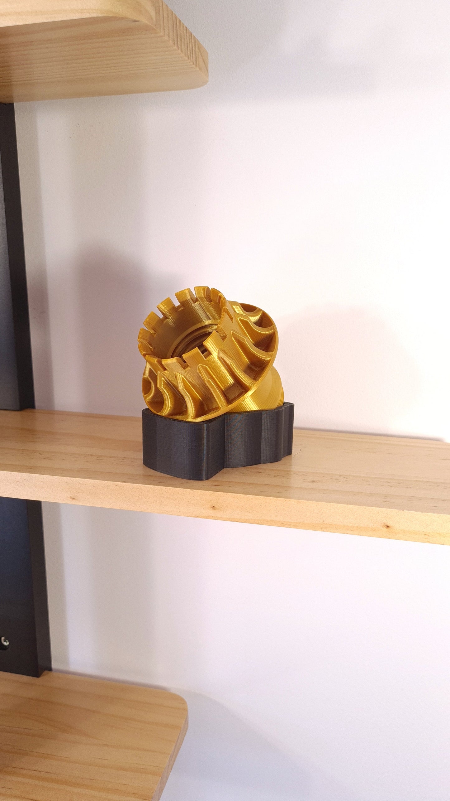 Gold 3D printed Formula 1 wheel replica display model on black base, perfect F1 fan gift.