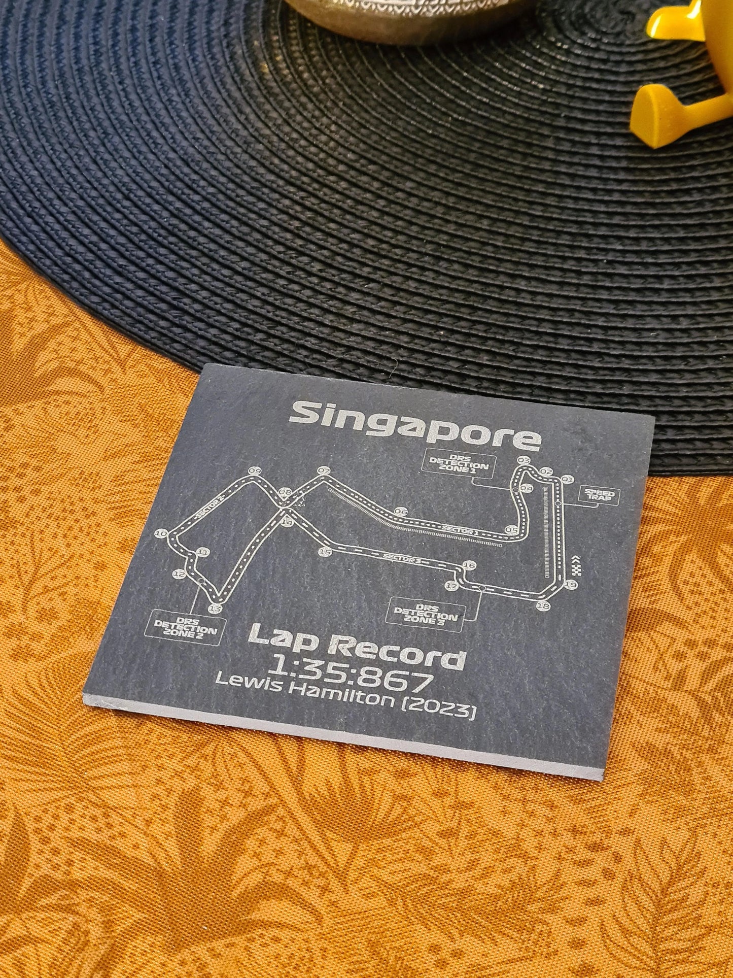 Singapore Formula 1 circuit map slate coaster featuring Lewis Hamilton's 2023 lap record, ideal F1 fan gift.