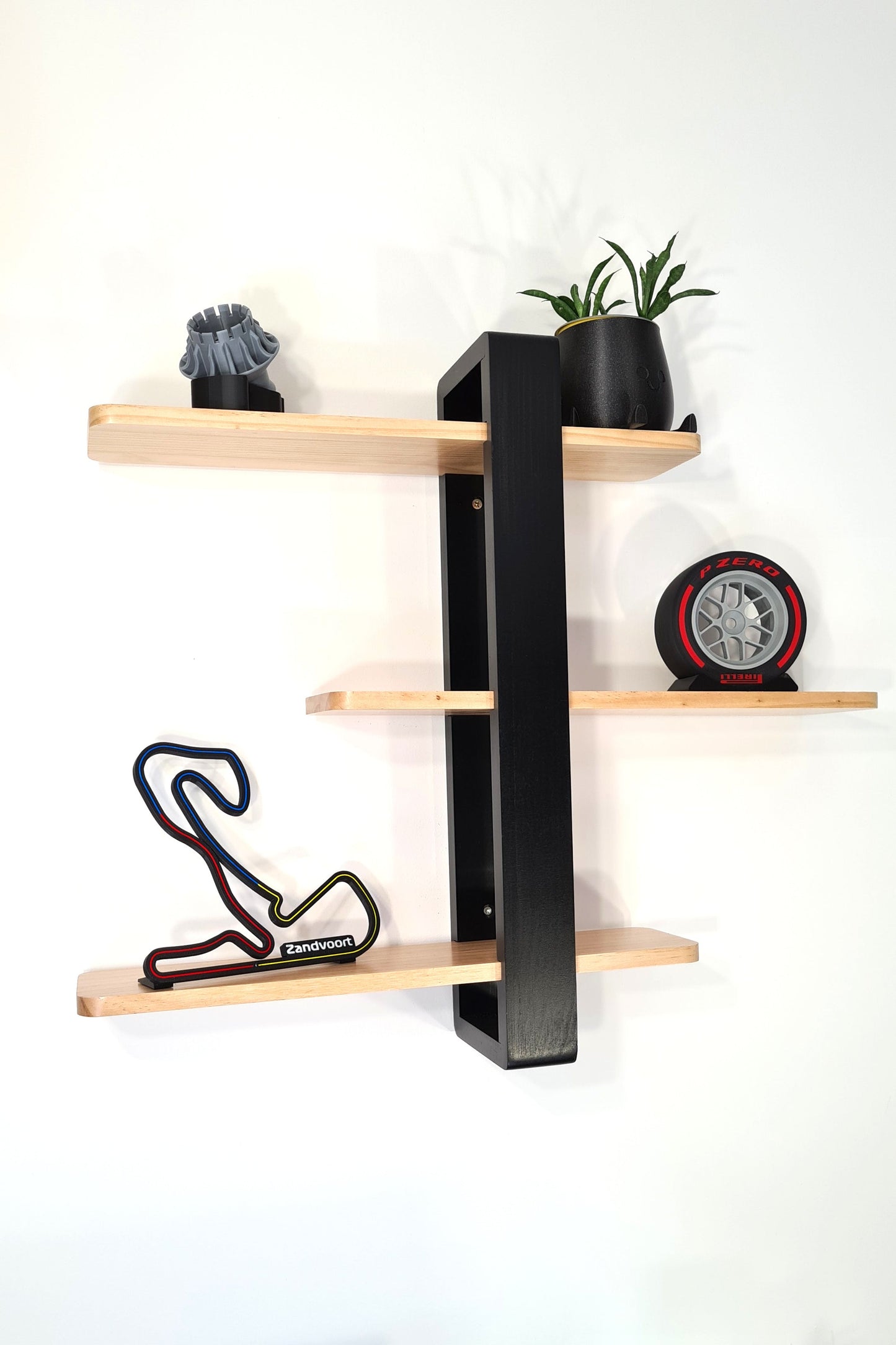 Modern F1 wall decor display featuring Zandvoort circuit 3D track, Pirelli tire replica, and motorsport fan gifts.