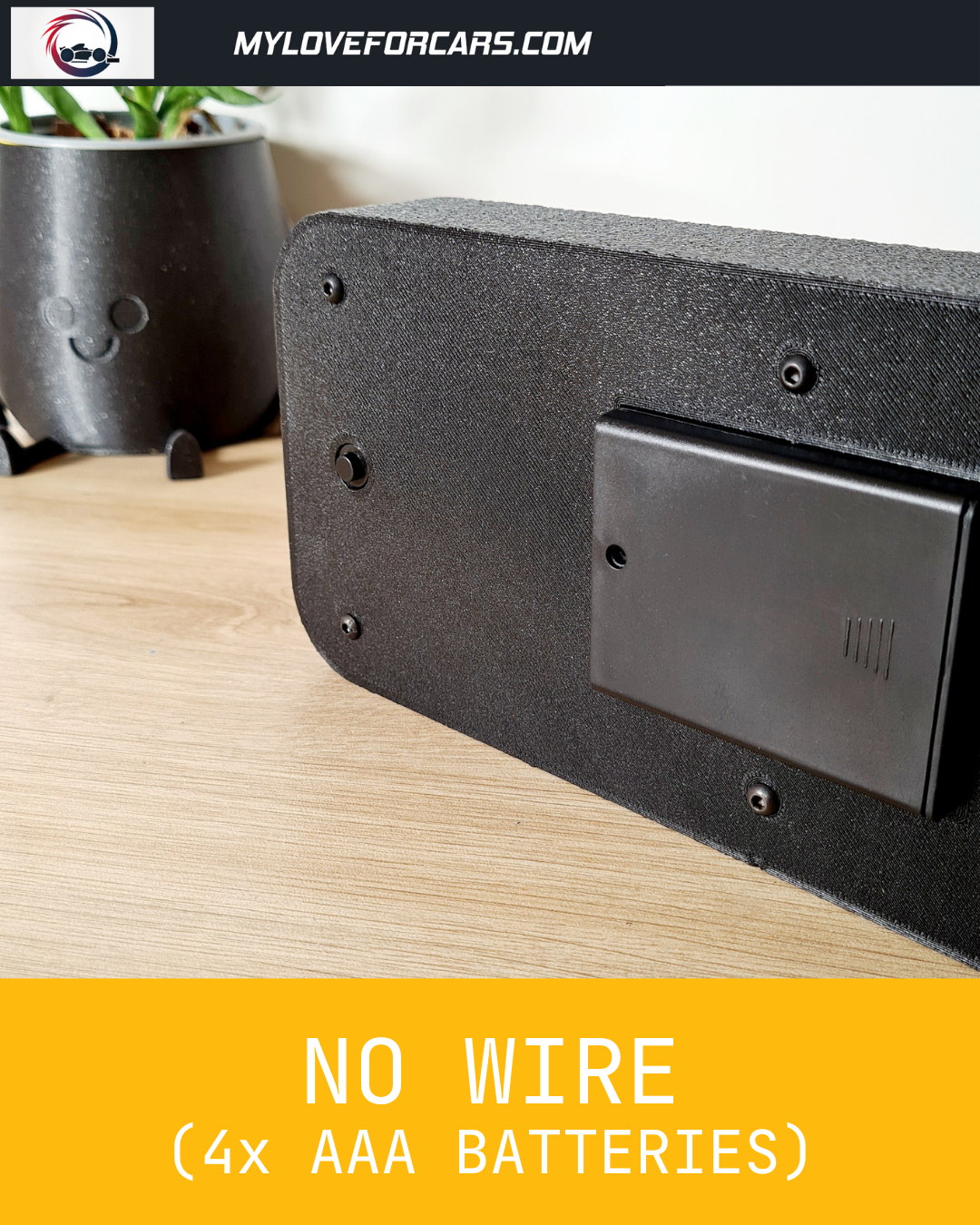 Black F1 motorsport display rear view, showcasing wireless 4x AAA battery power.