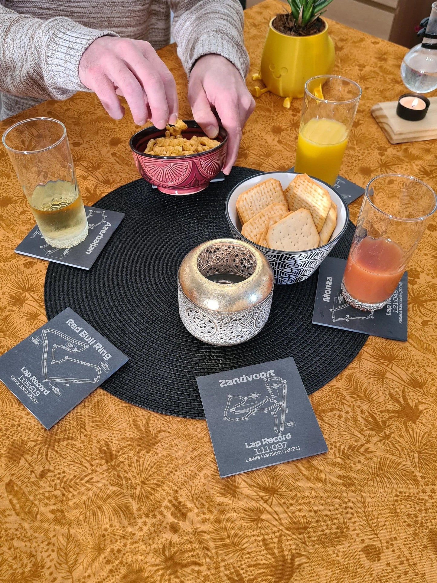 Engraved slate F1 circuit map coaster set (Azerbaijan, Red Bull Ring, Monza, Zandvoort) with lap records, ideal F1 fan gift.