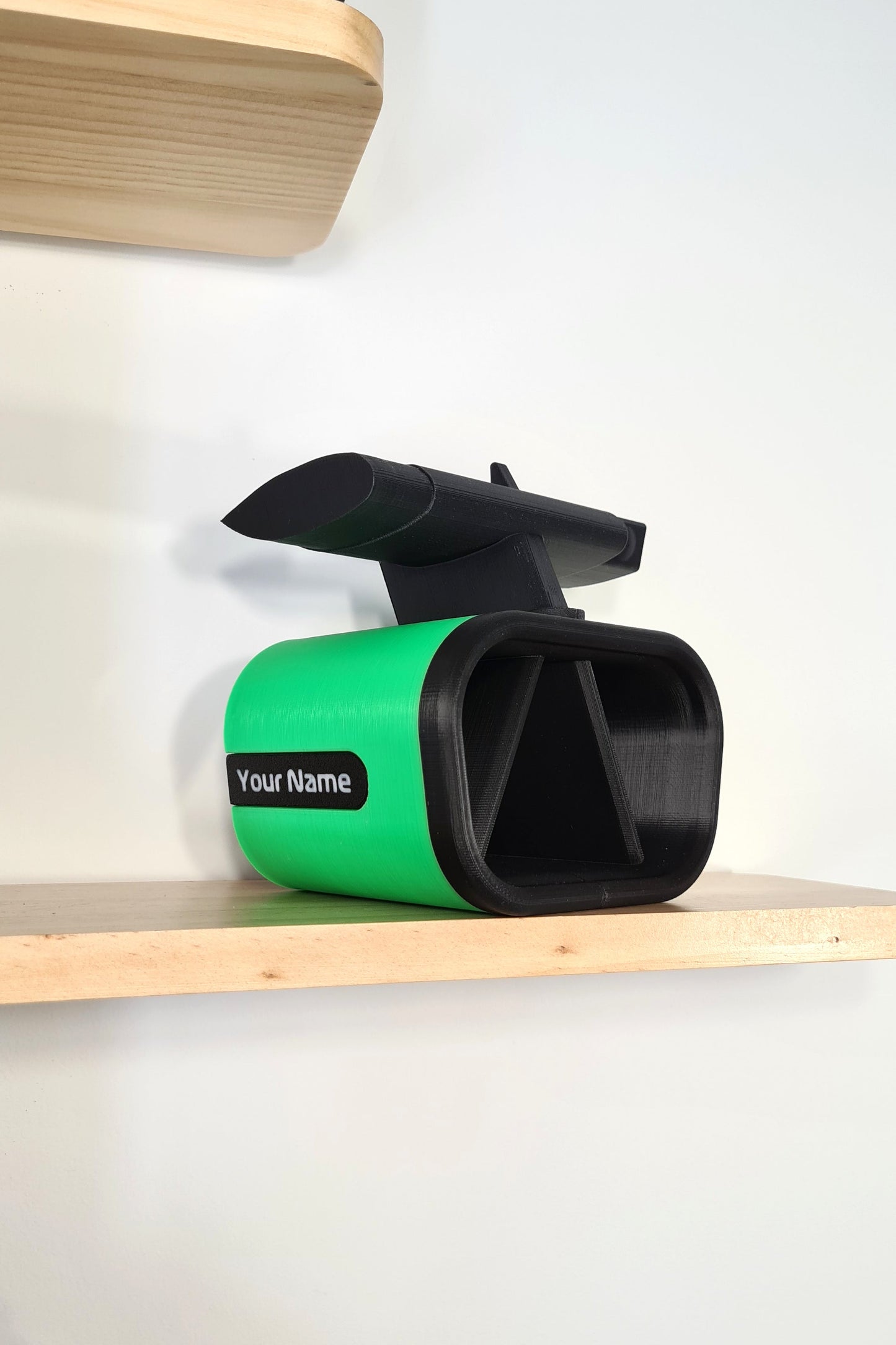 Customizable green and black 3D printed F1 race car phone holder with rear wing, perfect F1 fan desk decor.