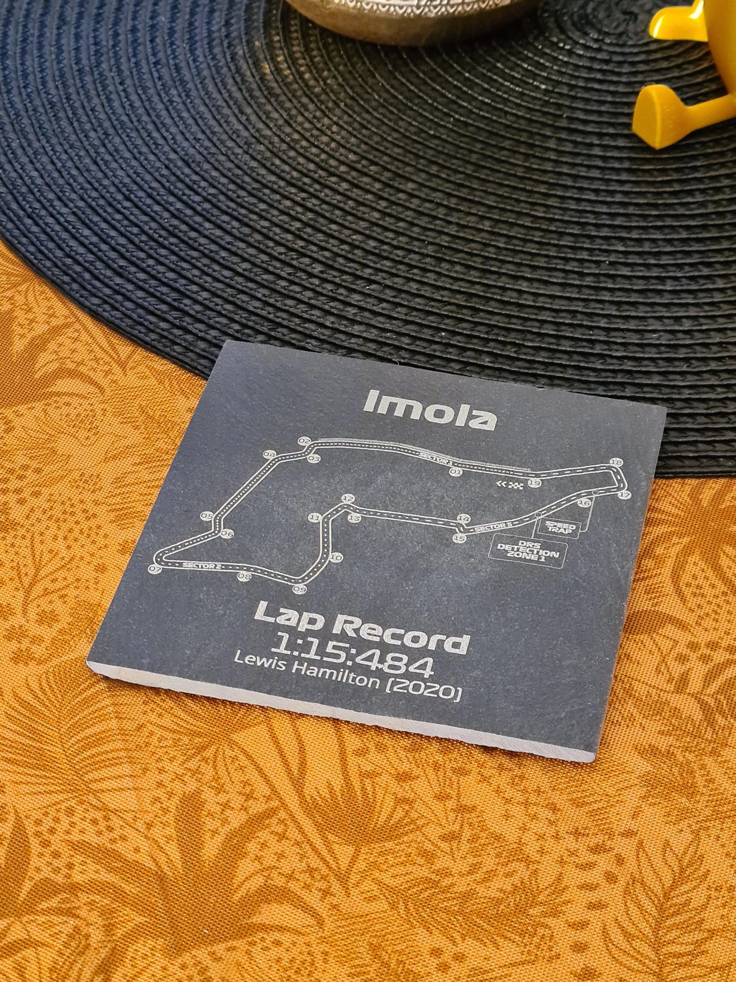 Imola F1 circuit map slate coaster displaying Lewis Hamilton's 2020 fastest lap record, unique F1 fan decor.