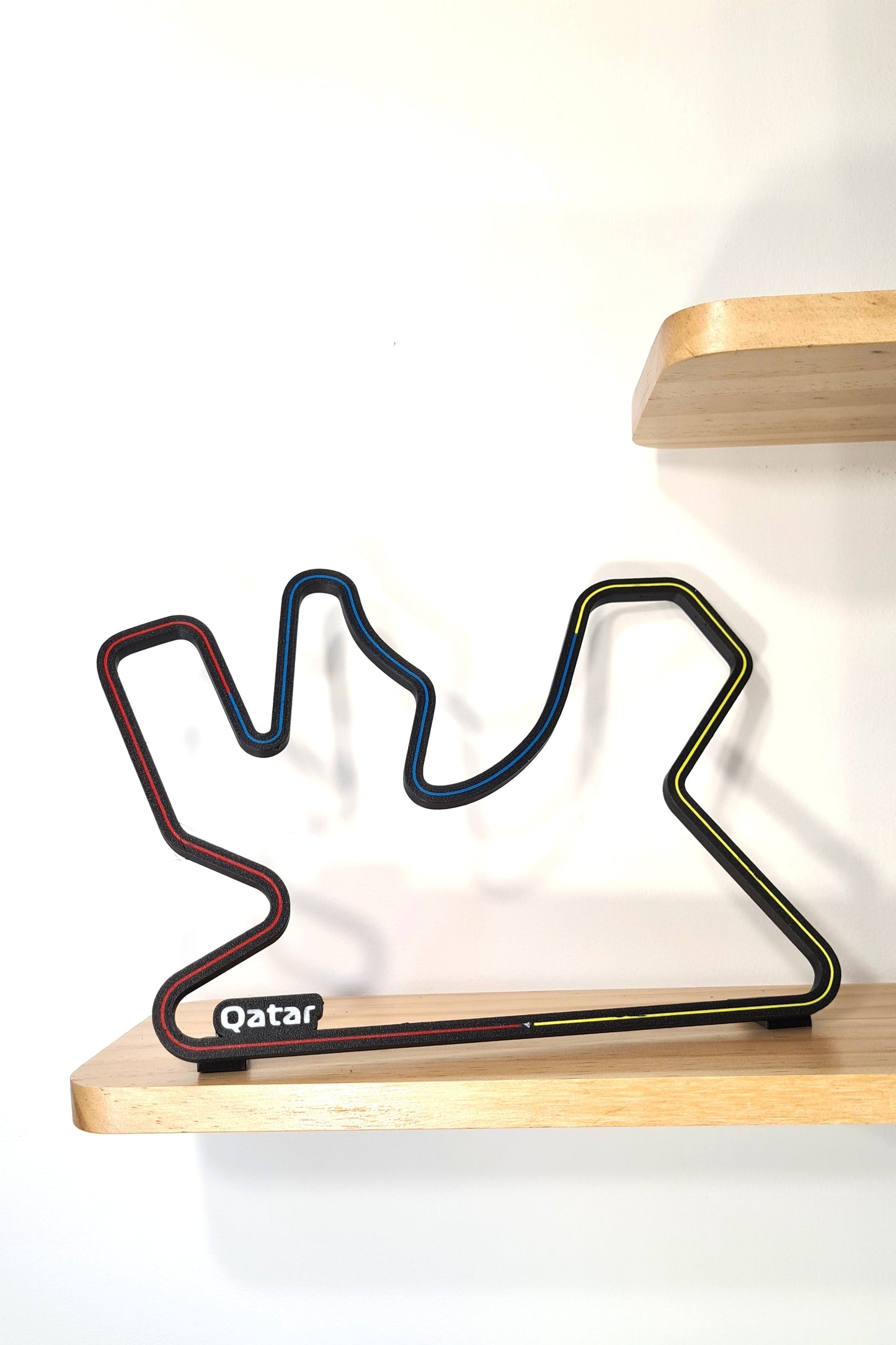 Qatar Formula 1 circuit 3D printed track replica with red, blue, and yellow lines, perfect F1 fan gift.