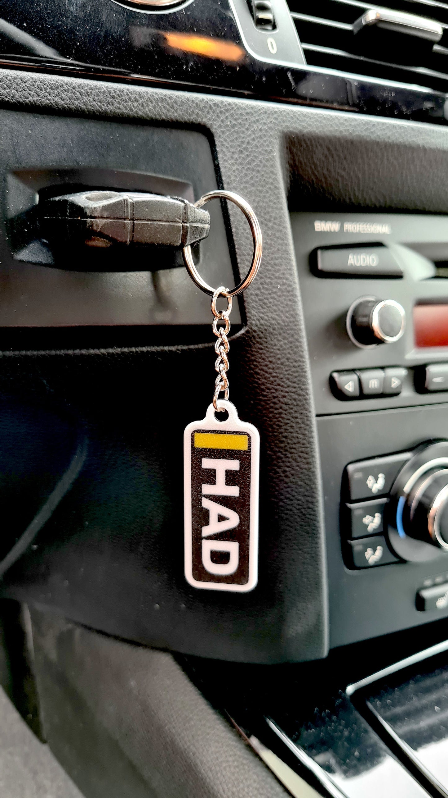 Custom HAD driver name tag F1 keychain with yellow accent, unique motorsport fan gift.