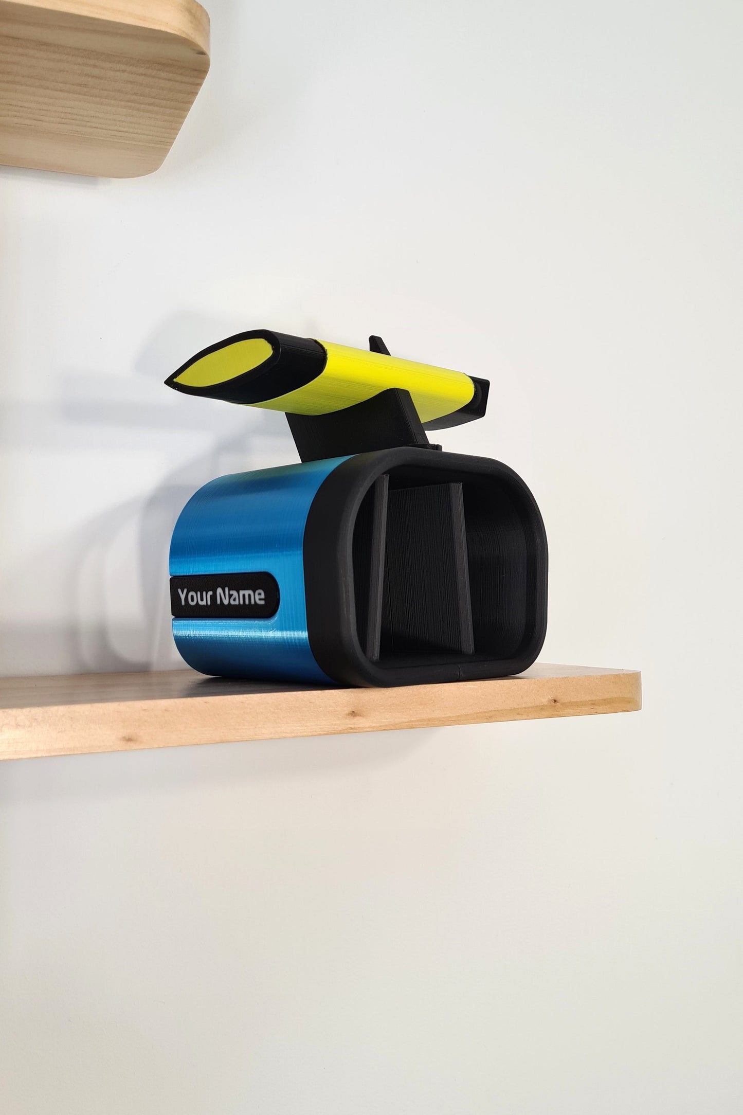 Customizable blue & yellow F1 car rear wing 3D print desk organizer for F1 fans.