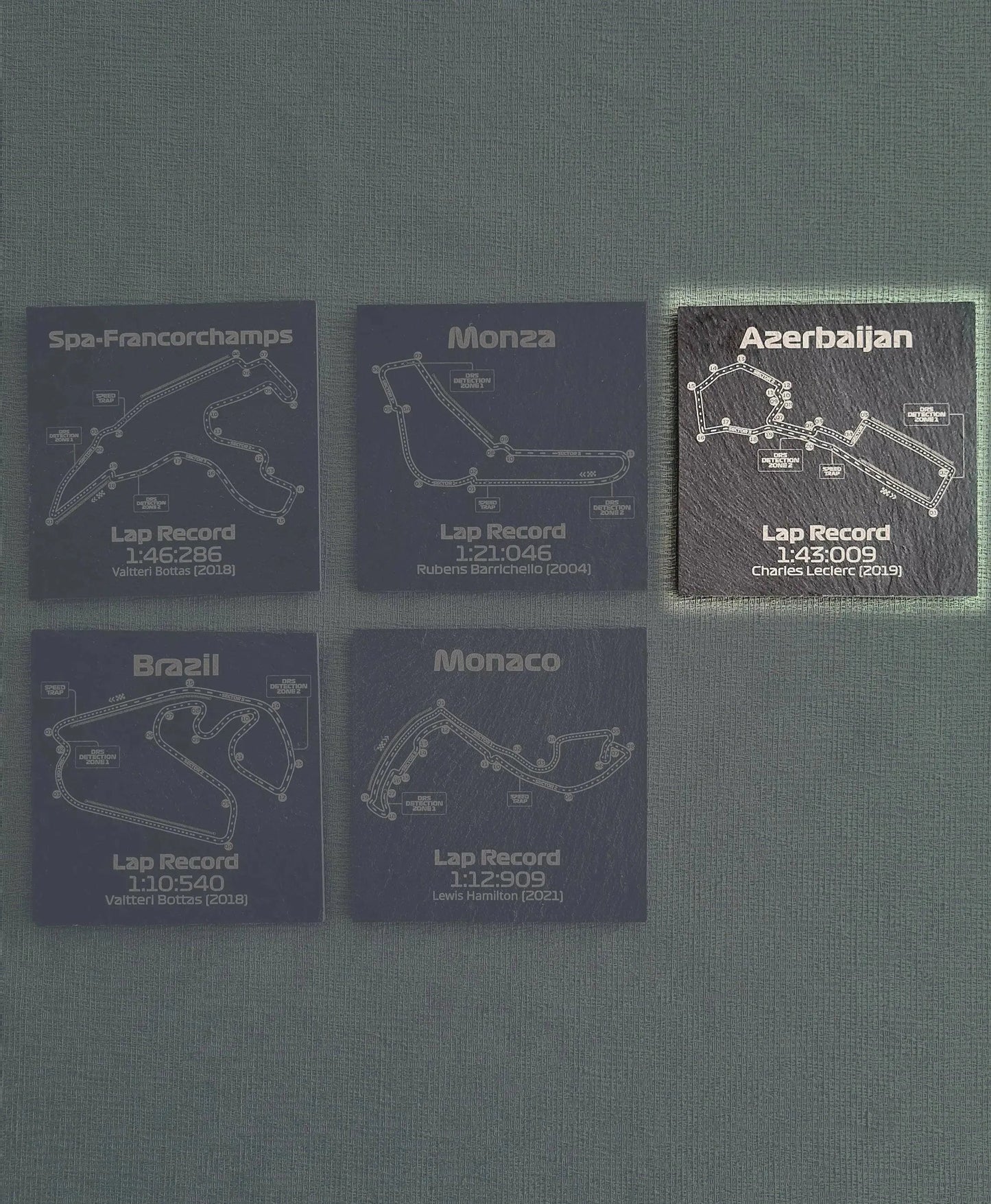 Set of 5 Formula 1 circuit slate coasters: Spa-Francorchamps, Monza, Azerbaijan, Brazil, Monaco track maps with lap records. Unique F1 fan gift.