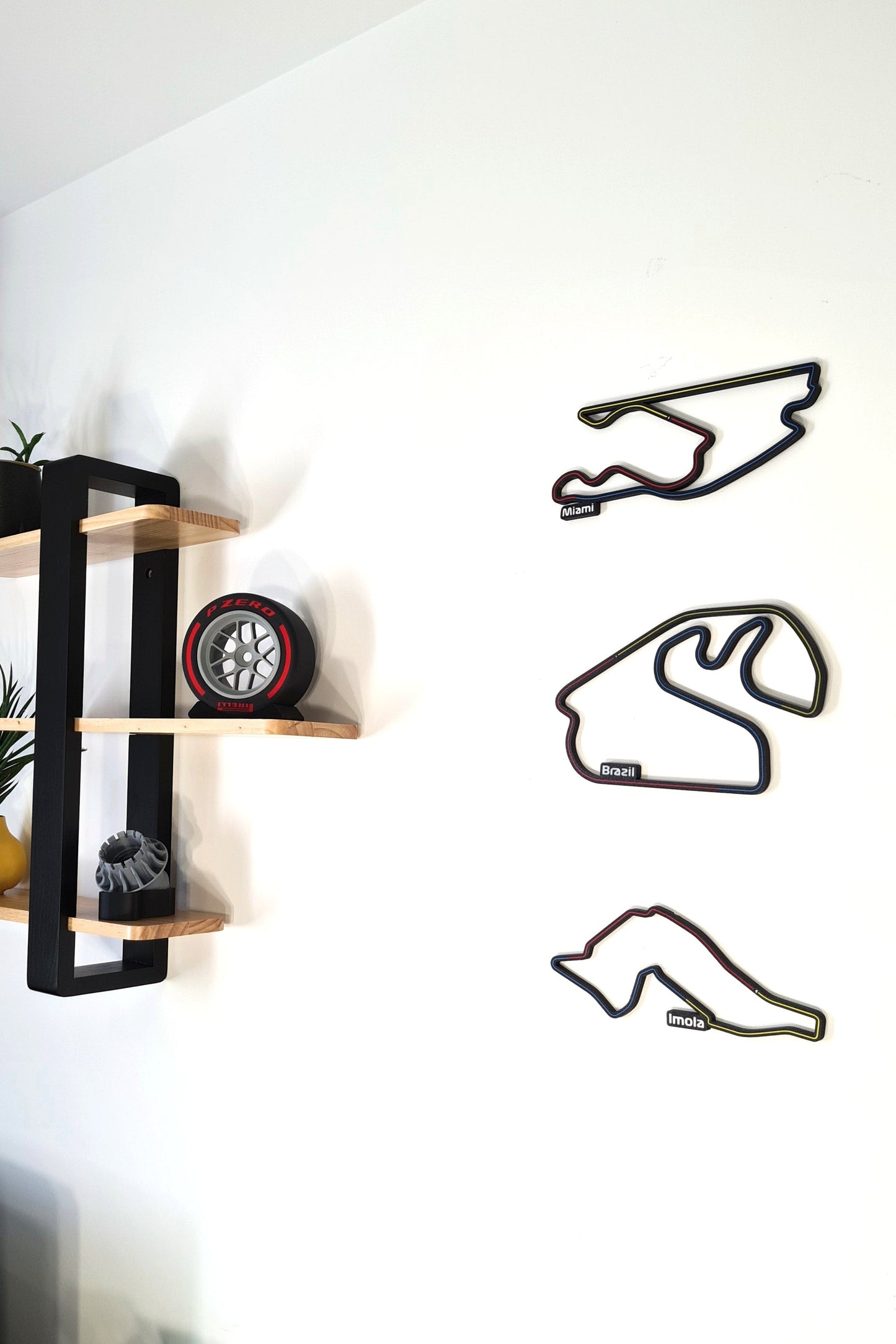3D printed F1 circuit track wall art featuring Miami, Brazil, Imola, and Pirelli racing tire replica, great F1 fan gift.