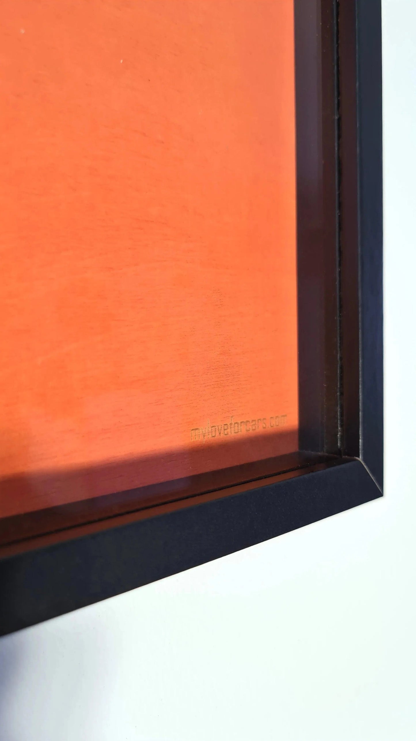 Orange F1 decor wall art in sleek black frame, myloveforcars.com branding for motorsport fans.