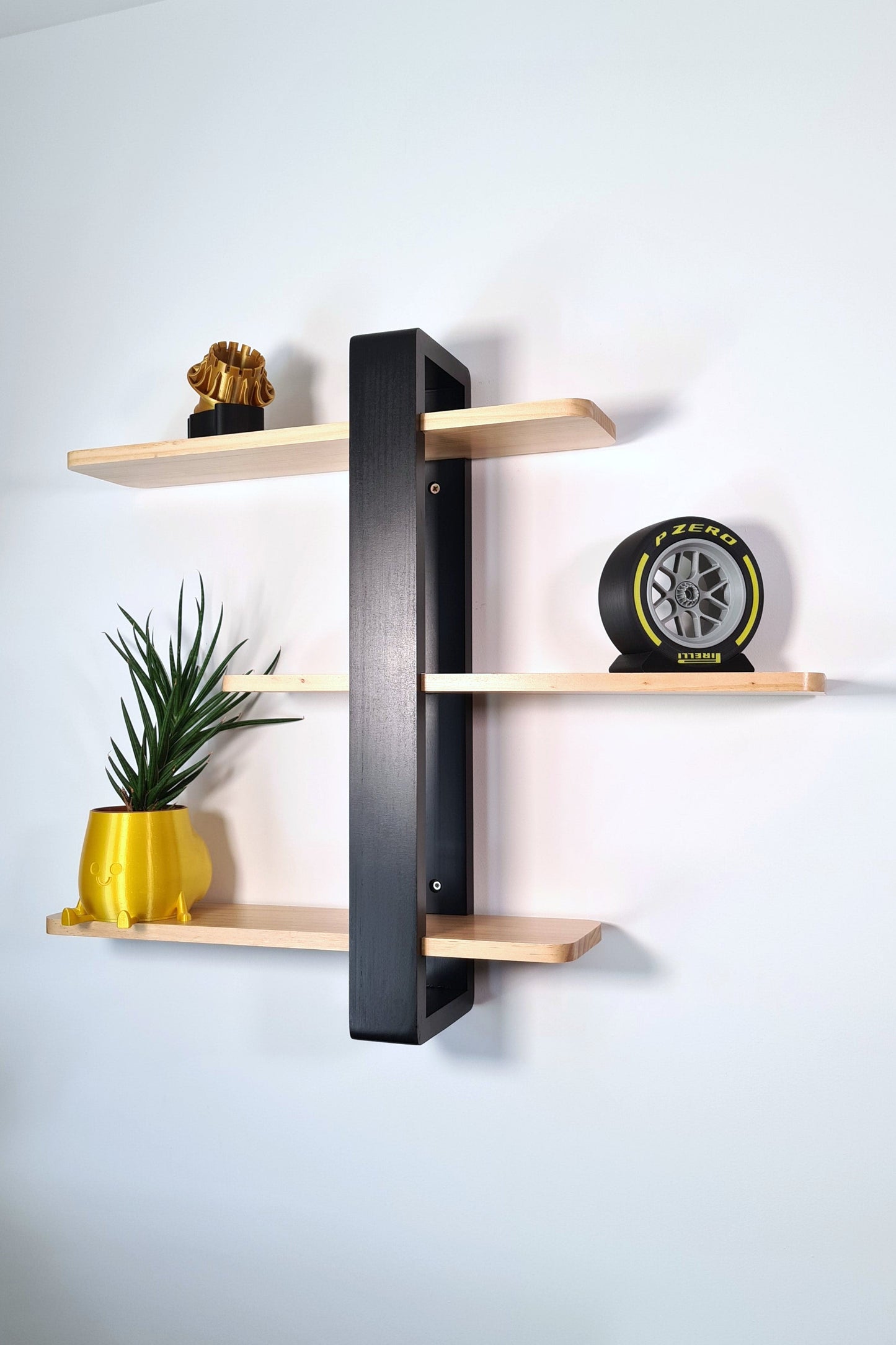 Gold F1 engine replica and Pirelli P Zero yellow tire display model for Formula 1 wall shelf decor.