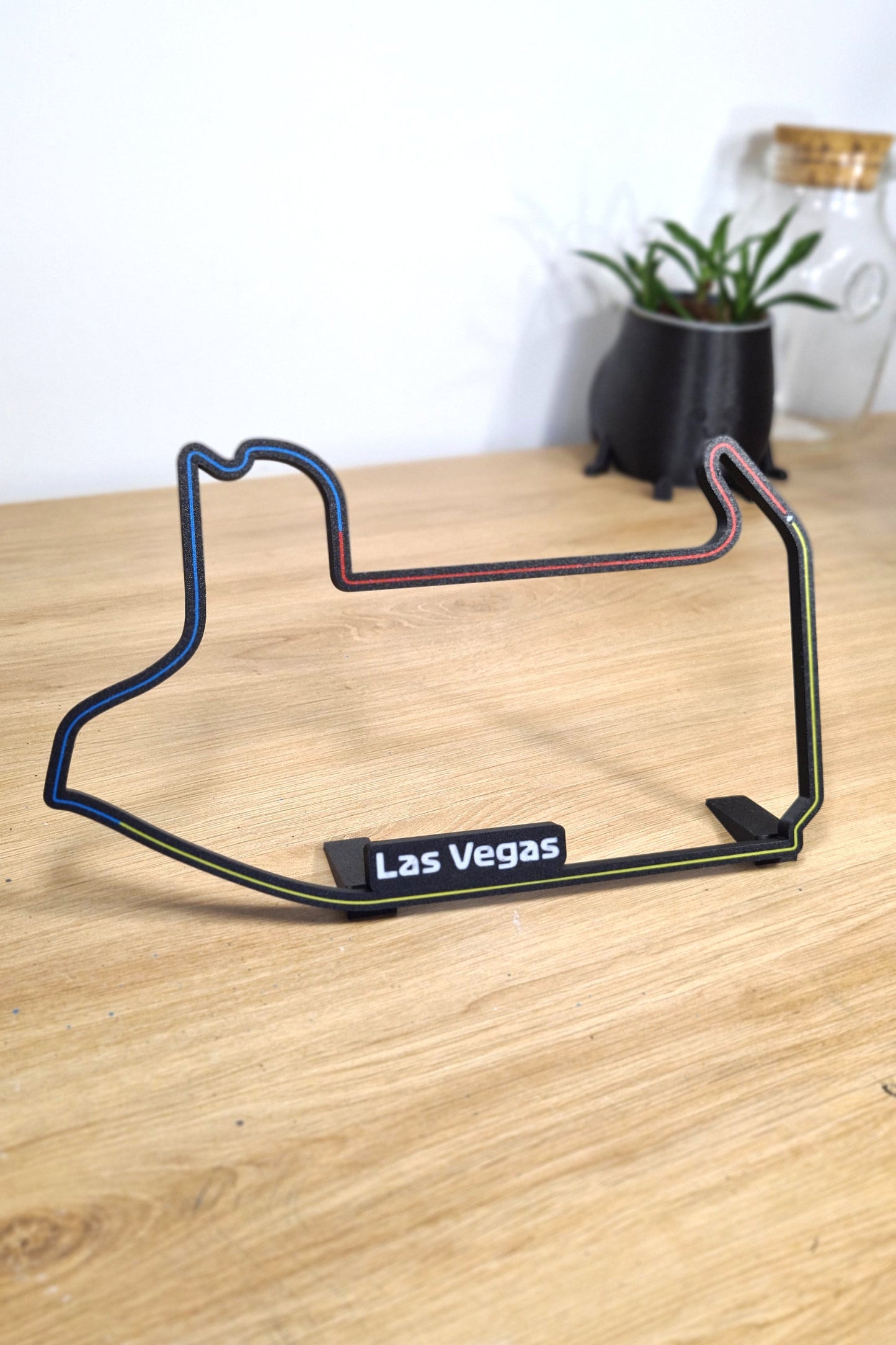 Las Vegas Formula 1 circuit 3D printed track model in black with blue, red, yellow lines.