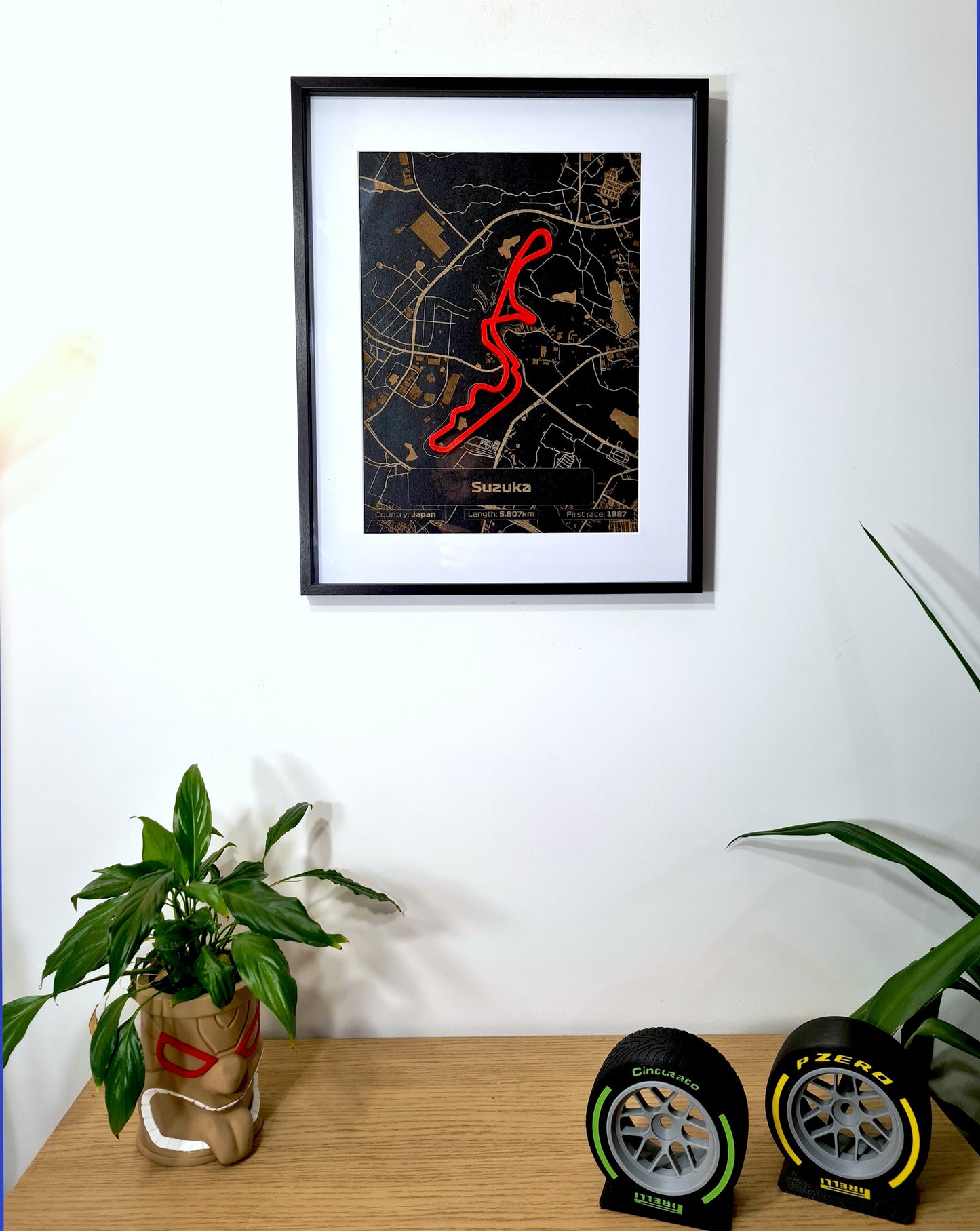 Suzuka Formula 1 circuit map framed wall art with red track, perfect F1 fan gift.