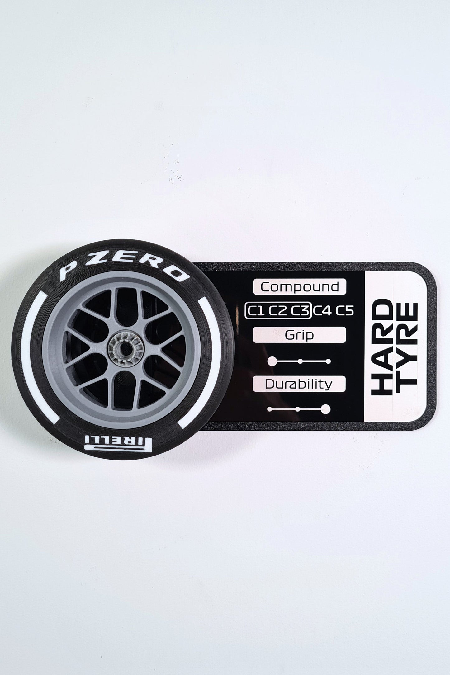 Pirelli P Zero Hard F1 tire 3D model replica with white stripe and stats display plaque, F1 fan gift.