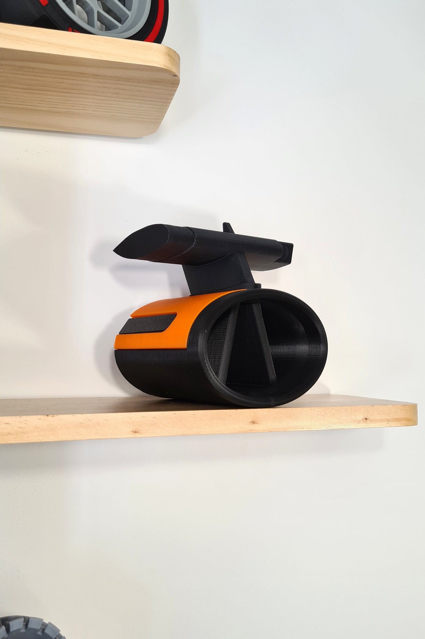 Black and orange 3D printed F1 car air intake with rear wing model, perfect Formula 1 fan gift.