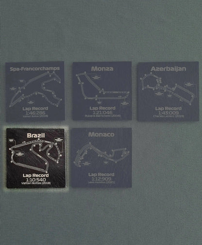 Formula 1 circuit slate coaster set with Spa, Monza, Azerbaijan, Brazil, Monaco track maps and lap records.