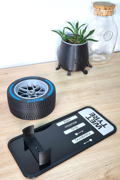 Pirelli Cinturato Wet F1 tyre replica with blue sidewall and 'Wet Tyre' display stand