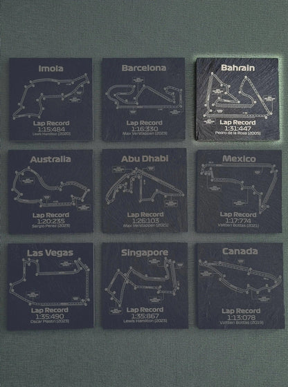9 black slate F1 circuit map coasters featuring multiple Grand Prix tracks and lap records, ideal F1 fan gift.