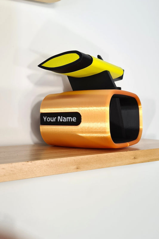 Personalized F1 3D printed desk decor: custom pit wall model with yellow car wing, unique Formula 1 fan gift.