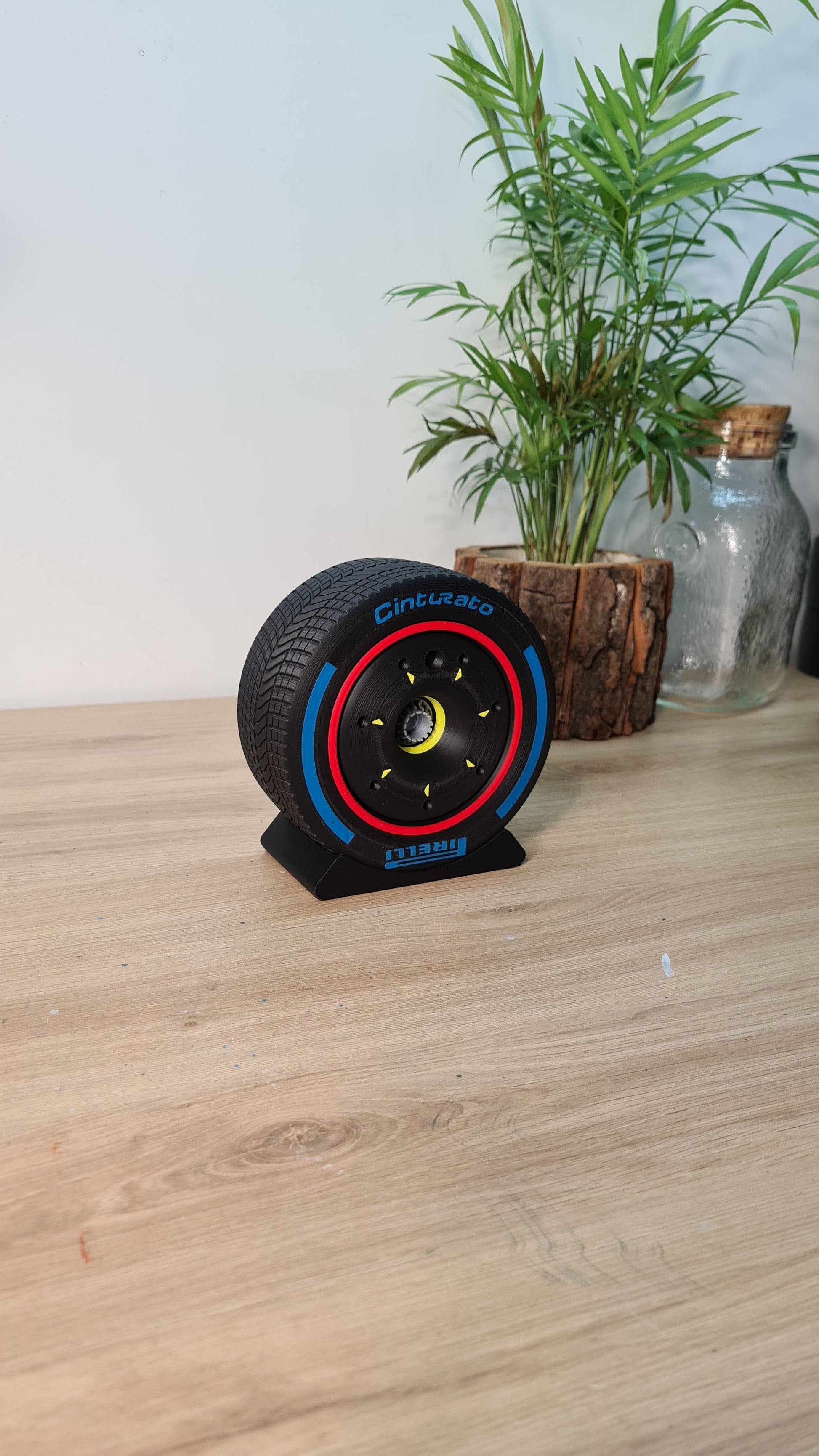 Black Pirelli Cinturato wet F1 tire replica with blue and red stripes, ideal motorsport fan gift.