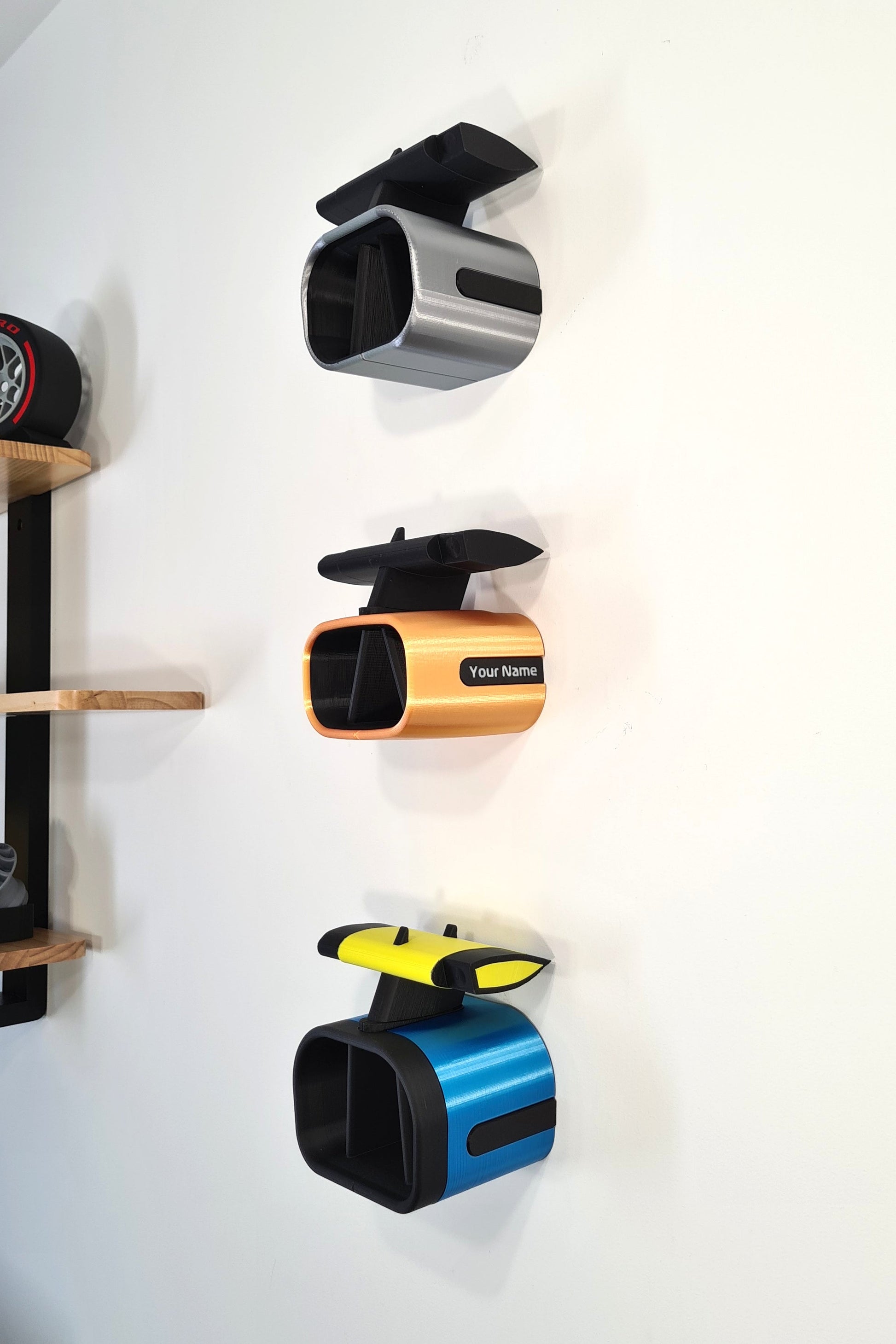 Customizable 3D printed F1 rear wing desk organizers in silver, orange, blue. Ideal Formula 1 fan gift.