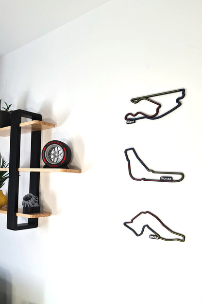 F1 motorsport decor featuring Miami, Monza, Imola 3D track wall art and Pirelli tire replica.