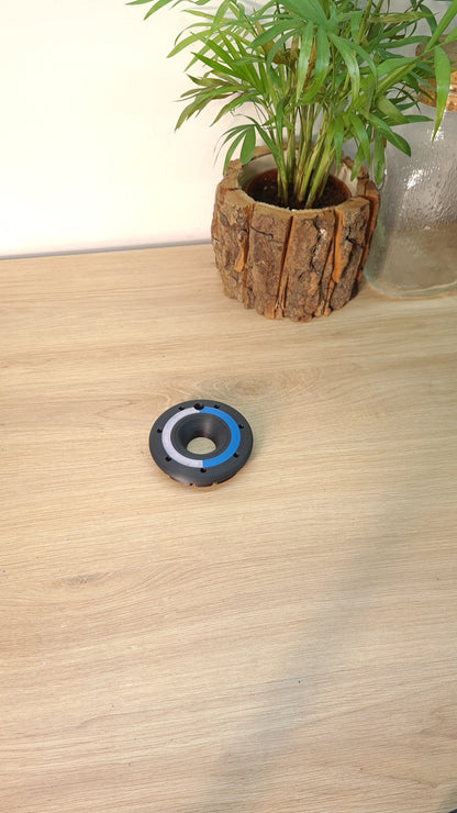 3D printed black, blue, white F1 wheel center lock replica, perfect Formula 1 fan desk decor.