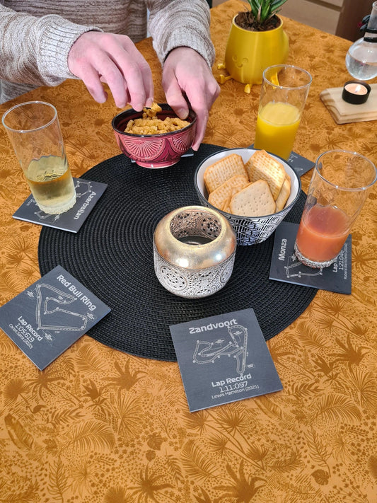 Detailed F1 circuit map slate coaster set, featuring Azerbaijan, Red Bull Ring, Monza, and Zandvoort, ideal Formula 1 fan gift.