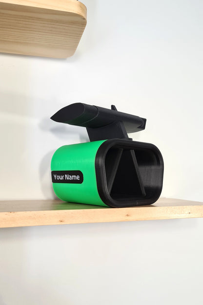 Customizable green and black 3D printed F1 race car phone holder with rear wing, perfect F1 fan desk decor.