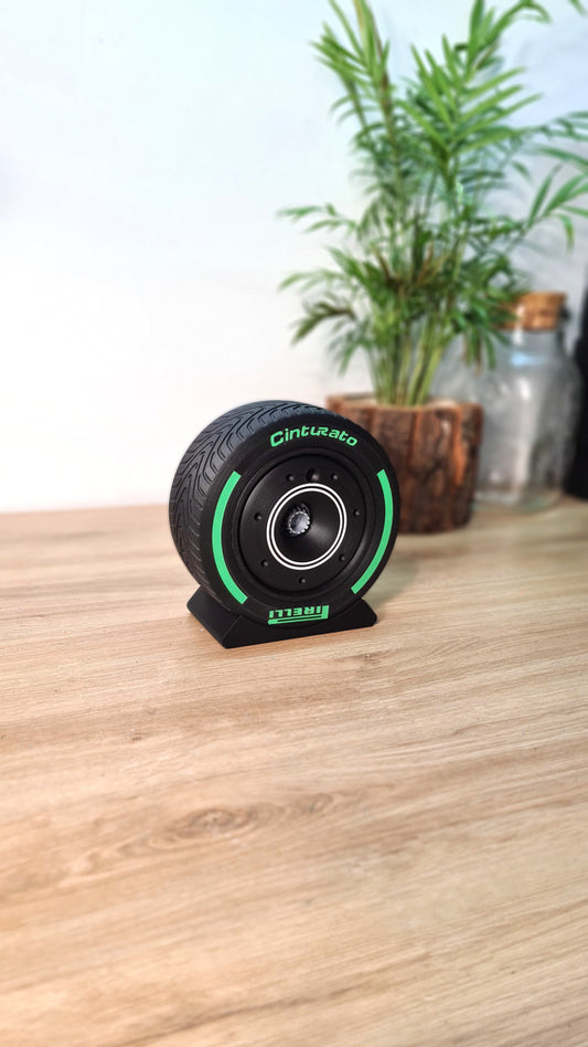 Pirelli Cinturato F1 tire replica Bluetooth speaker with green stripe, perfect motorsport gift.