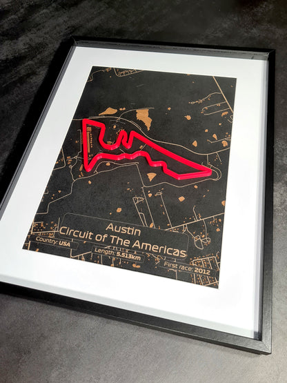 Image showcasing a framed Austin Grand Prix track with laser-cut detailing. The black frame complements the intricate metallic map design, highlighted by positive customer reviews on Etsy.