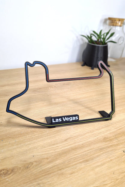 Las Vegas Formula 1 circuit 3D printed track model in black with blue, red, yellow lines.