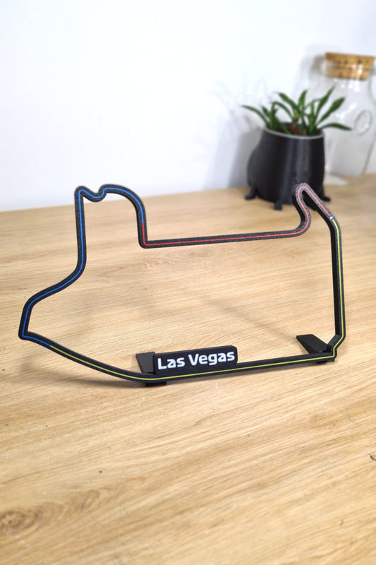 Las Vegas Formula 1 circuit 3D printed track model in black with blue, red, yellow lines.