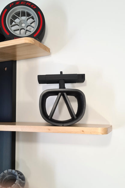F1 steering wheel and Pirelli P Zero tire replica display models, ideal motorsport fan gift.