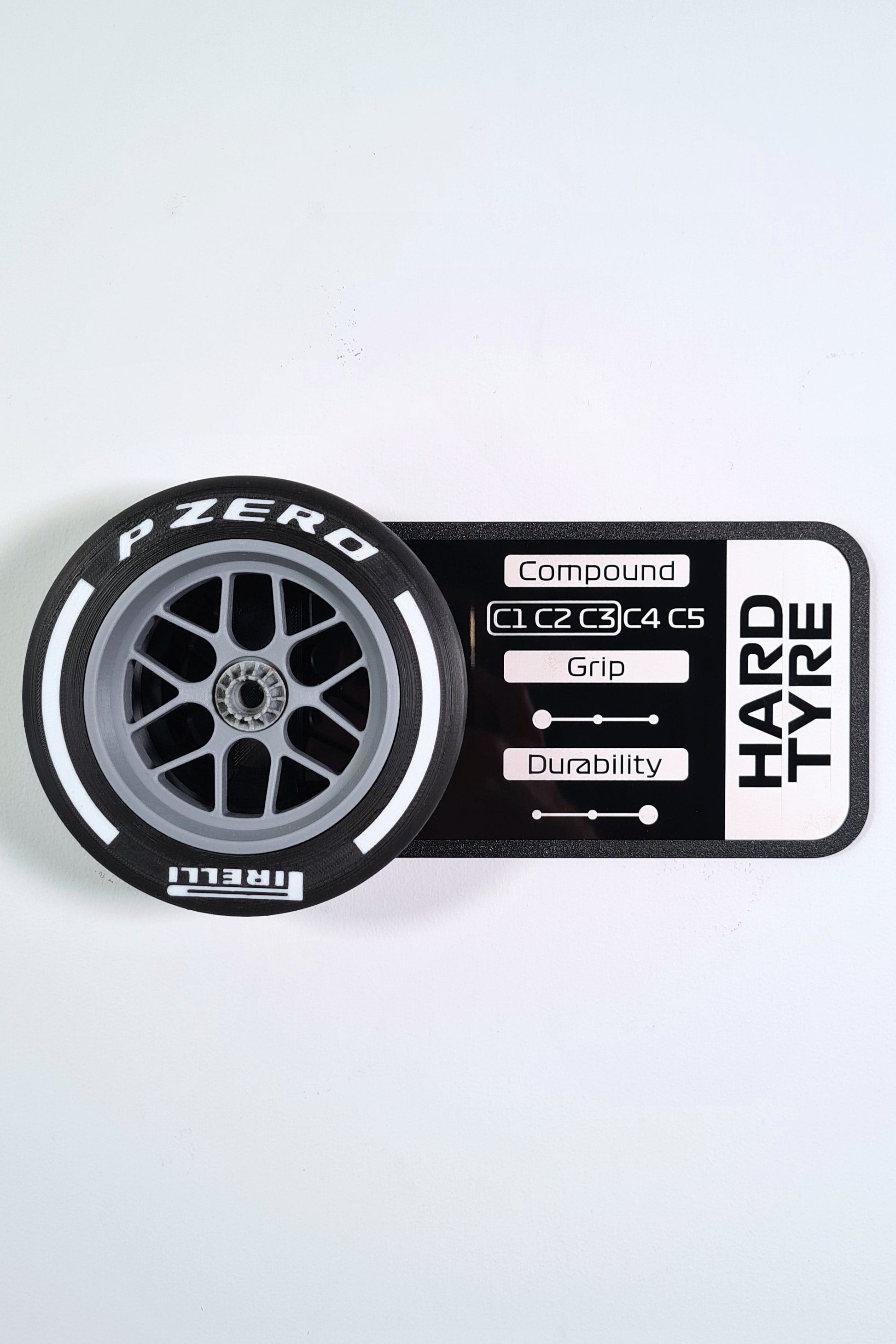 Pirelli P Zero Hard F1 tire 3D model replica with white stripe and stats display plaque, F1 fan gift.